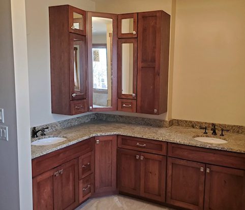 Rice Furniture & Design Center | custom designed and custom built bathroom cabinets with glass and wood