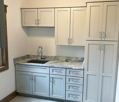 Rice Furniture & Design Center | custom built white cabinets and drawers for kitchen or laundry room