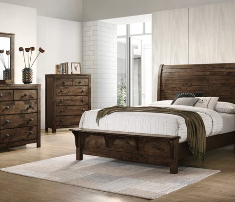 Rice Furniture & Design Center | dark wood bedroom furniture with white bedding in a white paneled room with a white brick accent wall